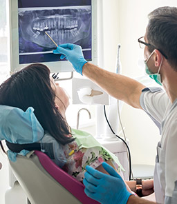 dentist reviewing x-rays with patient